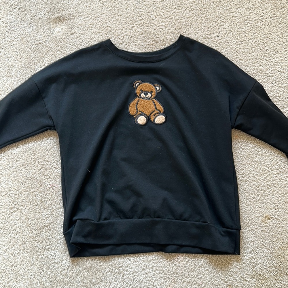 Women’s black teddy bear patch long sleeve shirt.